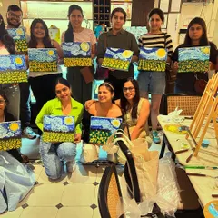 So much talent in one room! This happy group just finished their Van Gogh-inspired sunflower paintings. It's the perfect activity for a memorable get-together.