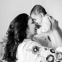 There's nothing like a mother's love. This black and white shot beautifully captures the playful and affectionate bond between a mom and her baby.