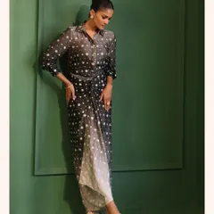 This printed drape skirt set is a modern and chic option for a cocktail party. The ombre effect and comfortable fabric make it a unique addition to your wardrobe.