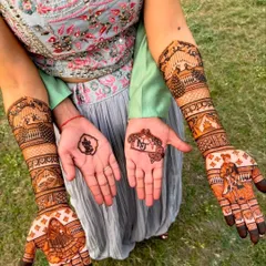 We specialize in highly detailed bridal mehndi that tells a story. This design features intricate figures of a bride and groom, a doli scene, and a Ganesh motif for blessings, all created with our 100% natural henna paste.