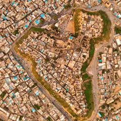 A top-down view of an ancient walled city, where the layout of the streets and buildings forms the shape of a "Flat frog." This is about finding patterns and stories in the landscape.