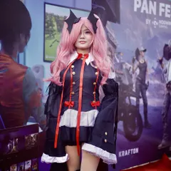 A fan in an intricate pink and black cosplay costume. My photos highlight the incredible craftsmanship and dedication of the Comic Con attendees.