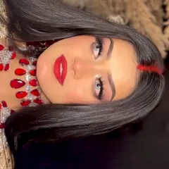 A creative angle of the Aishwarya look, showing the intensity of the red lips and the clean eye makeup.