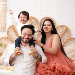 The pure bliss of family. Moments like this, with a child held high and surrounded by love, are what we will freeze in time together. This is more than a photo; it's the feeling of home.