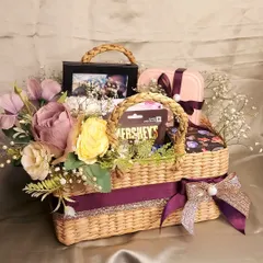 A basket of love for a special couple. This tiered kauna grass basket is a perfect anniversary or wedding gift, with separate compartments for his and her favorite things.
