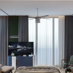 The TV and seating area in the parents' room, designed for relaxation. Layered curtains soften the natural light, while comfortable armchairs provide a cozy spot for reading or conversation.