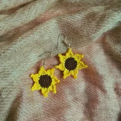 For all the sunflower lovers, we made these cheerful sunflower earrings. Their bright yellow petals and detailed brown center bring a little bit of sunshine to your day.
