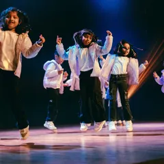 The energy is electric. Our youngest performers light up the stage, jumping with joy and showcasing the confidence they've built throughout the year.