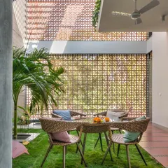 Why limit grass to the outdoors? In this unique courtyard, I installed a wall-to-wall artificial lawn to create an indoor picnic area. It's a surprising and delightful way to make your home feel green.
