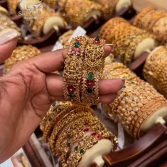 Another view of our intricate temple jewellery kadas. The craftsmanship on these antique bangles is exceptional, designed to give you a grand and traditional look for weddings and festivals.