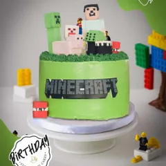 A blocky and brilliant Minecraft cake. This design features characters and elements from the popular game, perfect for a birthday build party.