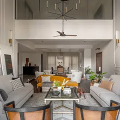An expansive view of the Rio Home's open-plan living and dining areas. The layout was designed to feel fluid and airy, connecting the large spaces while allowing each to have its own distinct personality and function.