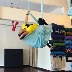 Another moment of creating shapes in the air. This pose, cradled in the hammock, is a beautiful combination of a backbend and a gentle twist.