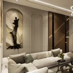 A view of a living room in Vishal Enclave, featuring a custom art installation within an arched niche and a large L-shaped sofa. The design focuses on creating a sophisticated space with unique artistic touches.