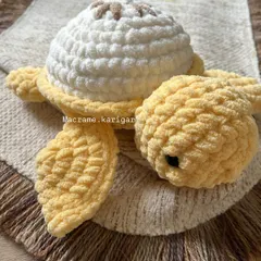 This is our lemon-themed turtle, with a bright white shell and a little brown detail on top. The cheerful yellow body makes it a sunny and happy addition to our fruit turtle family.