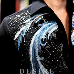 This is where art meets opulence. A detailed shot of the abstract wave embroidery, featuring a mix of blue beads, sequins, and metallic thread to create a shimmering, multi-dimensional effect.