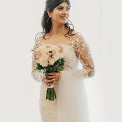 For the fairytale white wedding of your dreams. This look features flawless, glowing skin and soft, elegant waves, creating a timeless and ethereal bridal moment.