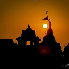 A temple stands in silhouette against the morning sun. For me, this is a moment of quiet devotion, where faith and nature meet in a simple, powerful frame. This is a classic golden hour shot that speaks to India's spiritual heart.