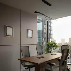 For a modern finance startup, we designed a conference room that balances professionalism with a connection to the urban landscape. Floor-to-ceiling windows offer expansive city views, while sound-absorbing wall panels and an elegant, minimalist light fixture ensure a functional and sophisticated meeting environment.