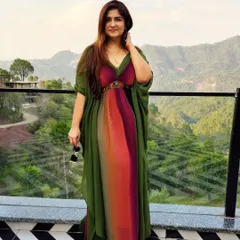 Serving city chic with a hint of hillside hues. This multicolored maxi dress from Zara is perfect for a vacation, offering both vibrance and ease.