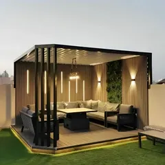 For this terrace, the goal was to create a sophisticated evening entertainment lounge. The design features a modern black pergola with slatted wood walls, a large L-shaped sofa, and a central dining table. I integrated multiple lighting solutions, including vertical LED strips, wall sconces, and under-deck lighting, to set the perfect mood after dark.
