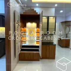 Here I designed a compact unit that cleverly combines a pooja mandir with a crockery cabinet. The wooden pooja unit features traditional carvings, while the adjoining glass cabinet provides practical storage for the dining area.