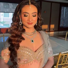 The perfect soft glam look captured in beautiful lighting. Notice how the highlighter catches the light on the high points of her face, creating a natural, lit from within radiance.
