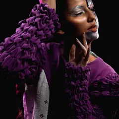 For this "Metaverse" themed shoot, I used silver metallic paint to create a futuristic, cyborg-like effect on the face. Paired with a sleek rope braid, the look is both alien and high-fashion.