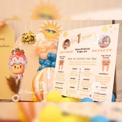 A special milestone board designed for twins Devansh and Devdutt, celebrating their "First Trip Around the Sun" with individual facts and photos.