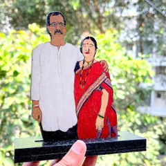 A wooden miniature created from a client's photo of their parents in traditional Marathi attire. It’s a beautiful way to honor family and preserve a cherished memory.