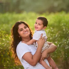 A joyful portrait of a mother holding her laughing baby boy. My focus is always on the connection and smiles that make each family unique.