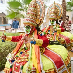 Kathakali performers in their vibrant costumes, adding an element of traditional storytelling and artistry to the celebration.
