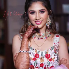 A bright and happy look for a mehendi or carnival party. The makeup features a pop of color on the eyes and a radiant smile, perfectly capturing the joyous spirit of the celebration.