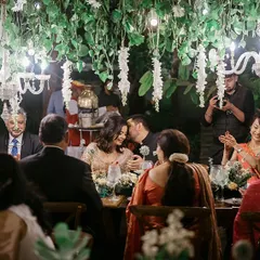 The smiles say it all. This was an intimate dinner party for Neha and Tushar in a Coorg forest, where we managed everything from setting up a satellite kitchen to ensuring the seven-course meal was served perfectly. It's these moments of pure joy that make all the meticulous planning worthwhile.