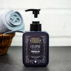 A lifestyle shot of the shower gel in a bathroom setting, with a towel and basket in the background. This helps customers visualize the product in their own space.