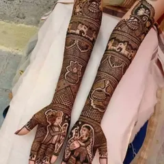 A divine Radha-Krishna design for a client who wanted something spiritual. The full-arm work includes the deities, elephants, lotus flowers, and a sacred kalash pot.