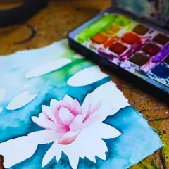 A beautiful water lily coming to life with watercolors. Our online classes guide you through techniques like layering and blending to achieve delicate effects.