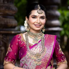 A close-up of a magnificent silver-toned bridal set with intricate detailing. This is a showstopper piece, perfect for a grand reception.