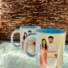 A side view of the custom illustrated coffee mugs, highlighting the detailed artwork of the couple. These make for a wonderful keepsake that they can use every day.