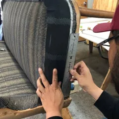 This mid-century modern settee is beautifully upholstered in our hand-printed linen. The 'Sonoma' pattern in Glitter Graphite, designed by Seema Krish, creates a unique texture with its striking yet muted metallic gold on black.