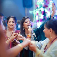 A live shot from a performance, where I am interacting with the audience. My team captures these moments to create showreels that showcase the experience I offer.