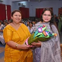 Being welcomed with a bouquet at a school session. It is always rewarding to connect with students.