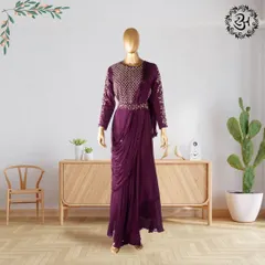 This deep purple drape dress is part of my hand-stitched Indo-Western collection. The georgette fabric flows beautifully, and the embroidered bodice adds a touch of regal elegance, making it perfect for the wedding season.