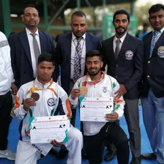 Posing with my district championship winners and fellow officials. It is a proud moment to see my athletes' hard work recognized as they get selected for the state karate championship.