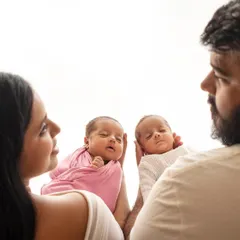 Double the blessing. This photo of parents gazing at their newborn twins is just filled with so much love and wonder. A truly precious moment.