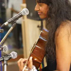 What a night. This photo captures the energy of a live artist session, where the performer owned the stage with her original music, creating a magical and memorable experience for everyone.