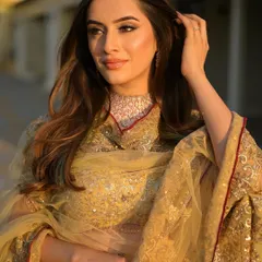 A golden hour moment. The soft, natural light makes her flawless makeup look even more radiant. This is a perfect, natural glam for any pre-wedding event.