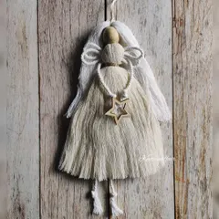 A delicate macrame angel ornament, made for a custom Christmas order. This would look so beautiful hanging on a Christmas tree. All my ornaments are handmade with natural materials.