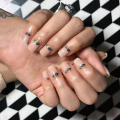 Ward off negativity in style with these stunning evil eye nails. Each nail features a detailed, hand-painted evil eye design on a clean nude base.