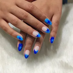 Another look at the blue starry nails. The combination of royal blue and sky blue with the star motif is both bold and playful.